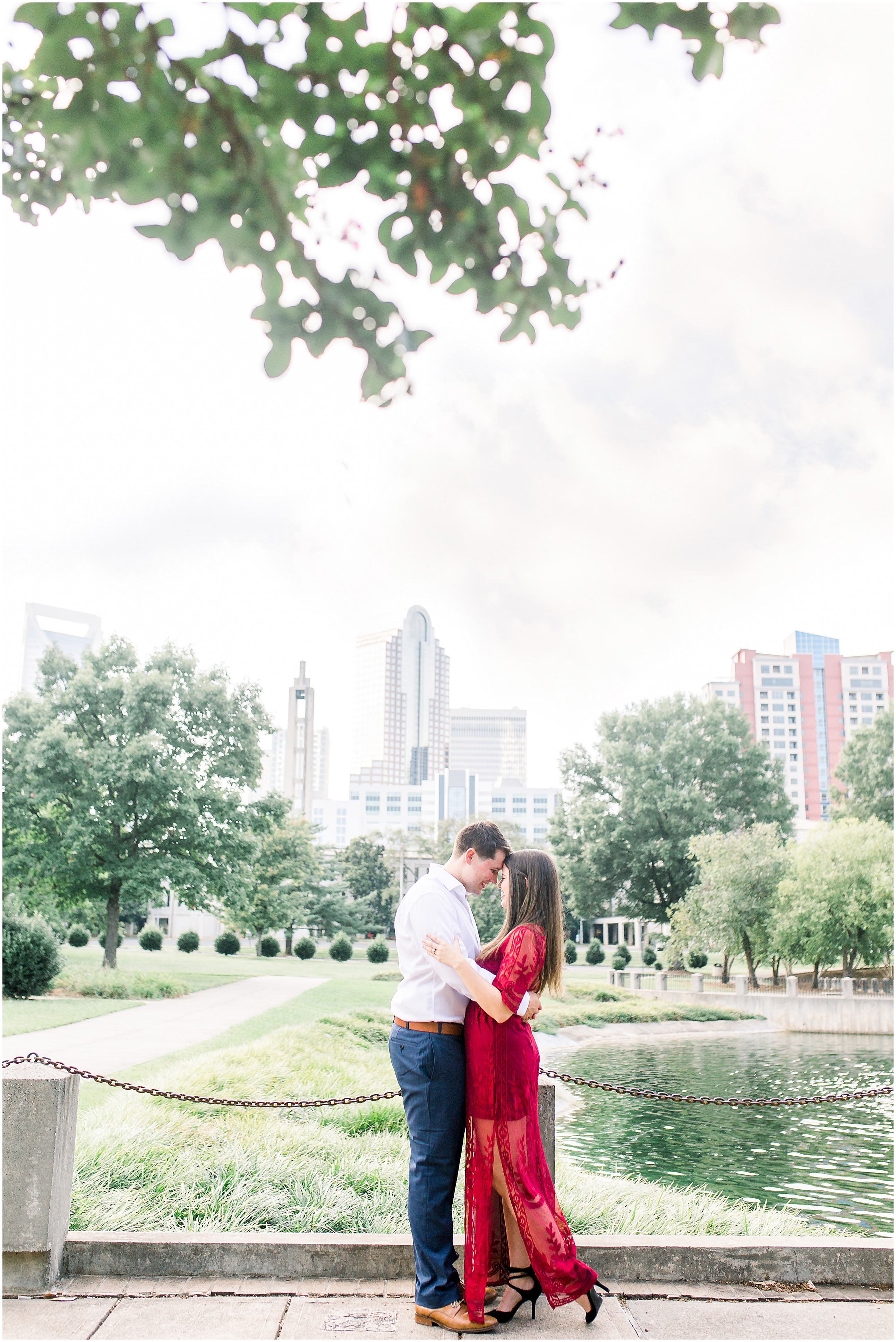 Engagement Session in Marshall Park with Charlotte skyline