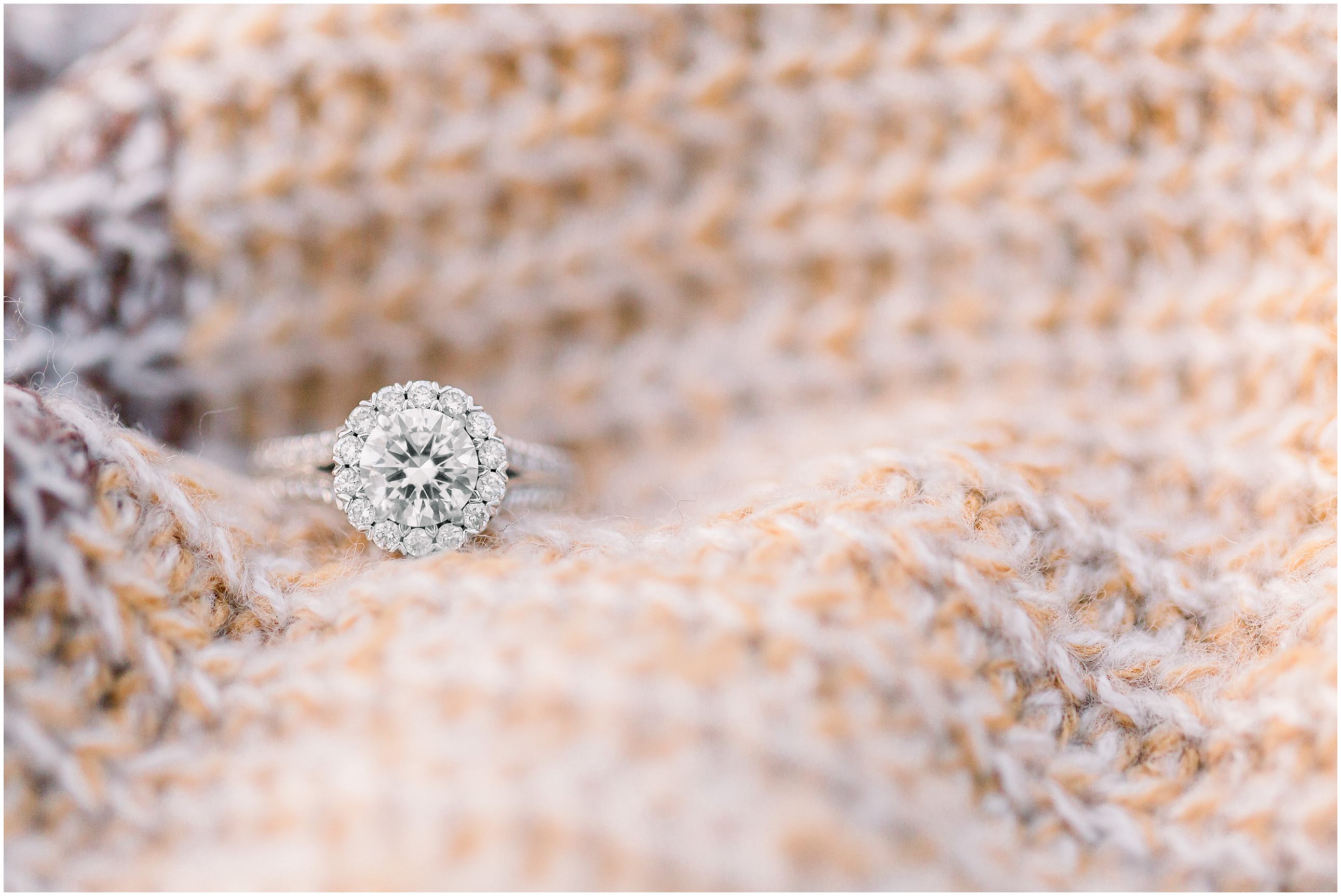 ring shot from engagement session on sweater