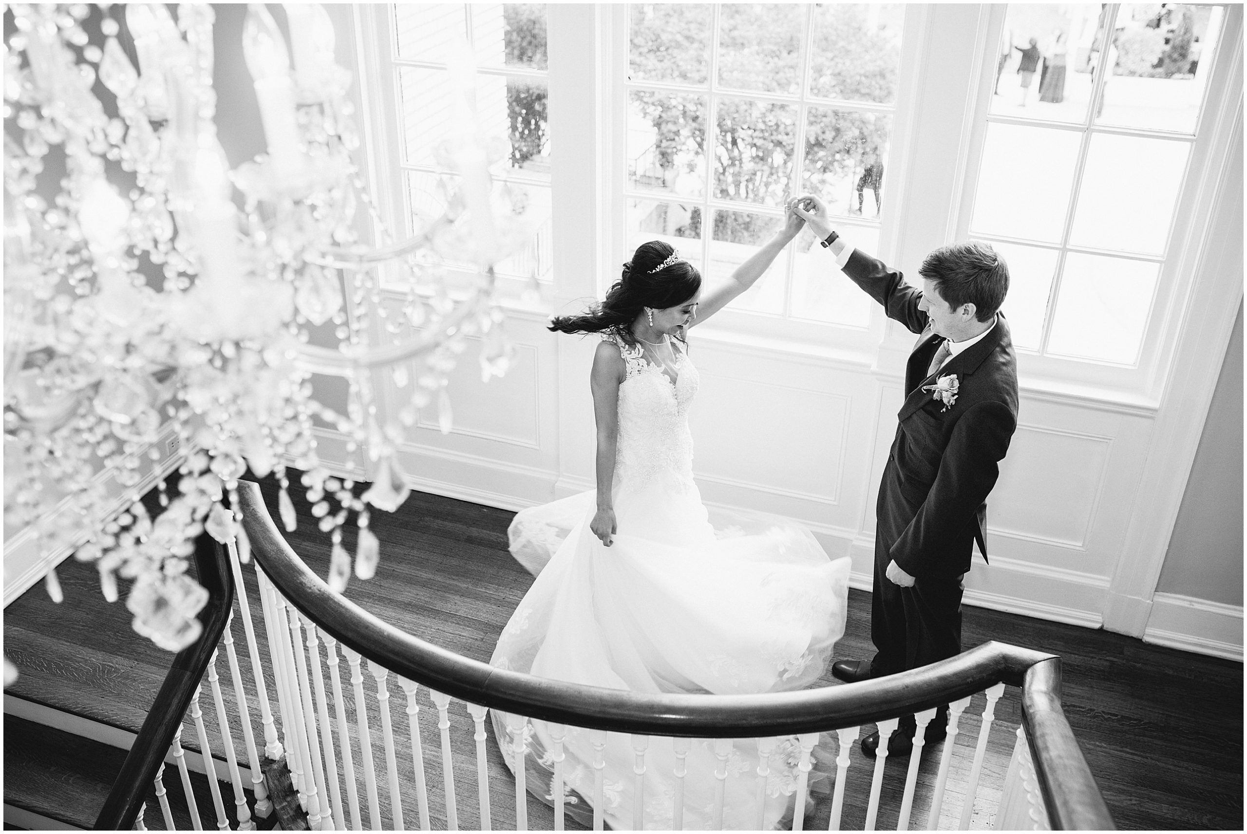 couple dancing on separk mansion staircase